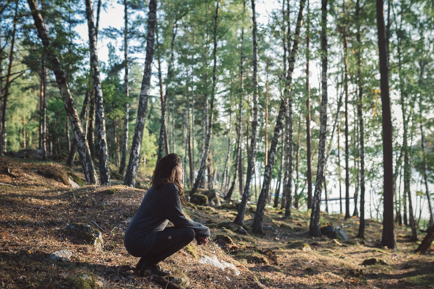 woman sitting in a forest