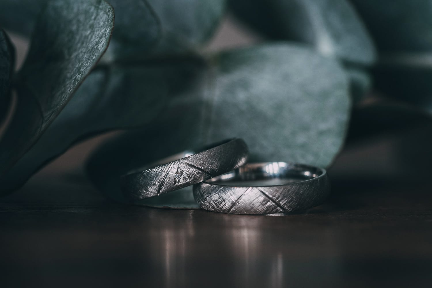 wedding rings and eucalyptus